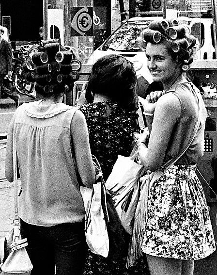 contemporary modern girls on the street wearing hair curlers