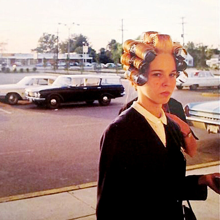 1960s woman in curlers on the street
