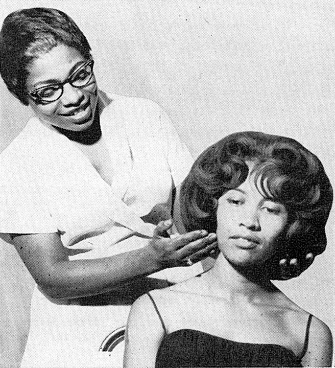 vintage black hairstylist presents her hair model