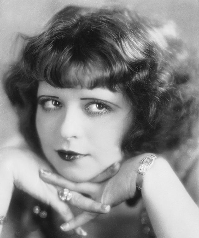 Clara Bow 1920s actress natural curl hairstyle with vintage bangs