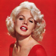 carroll-baker-1950s-blond-actress-in-red-wearing-red-lipstick